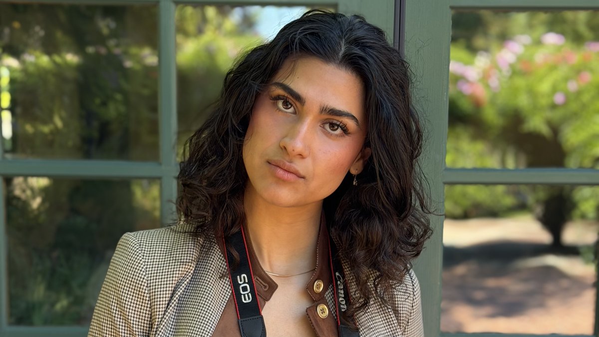 Nadia with her camera and team badge